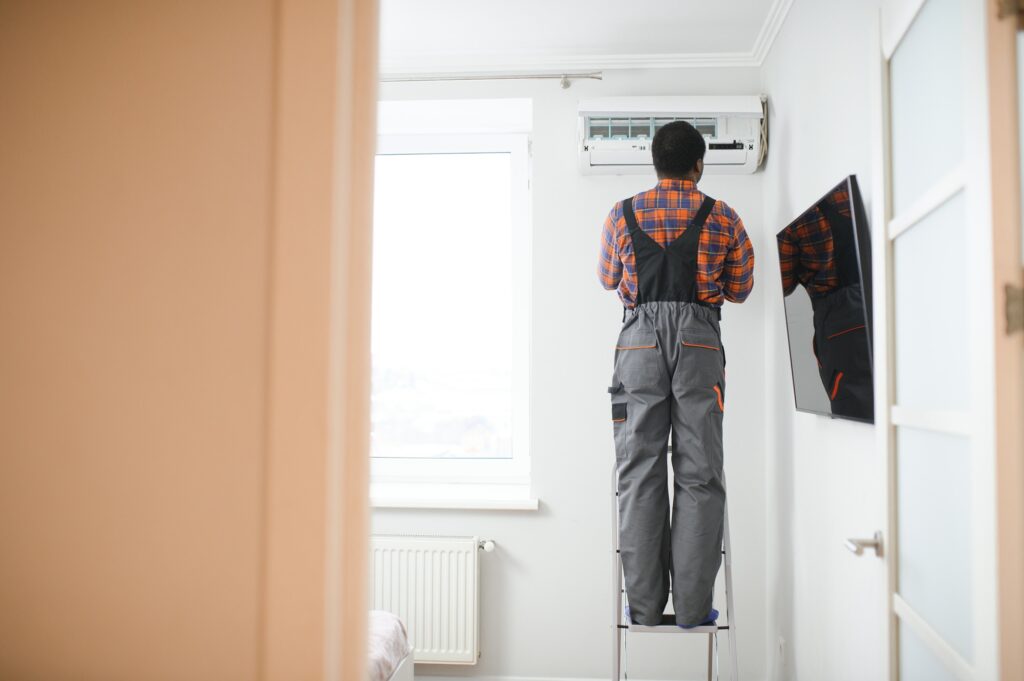 AC Electrician Technician Repairing Air Conditioner Appliance